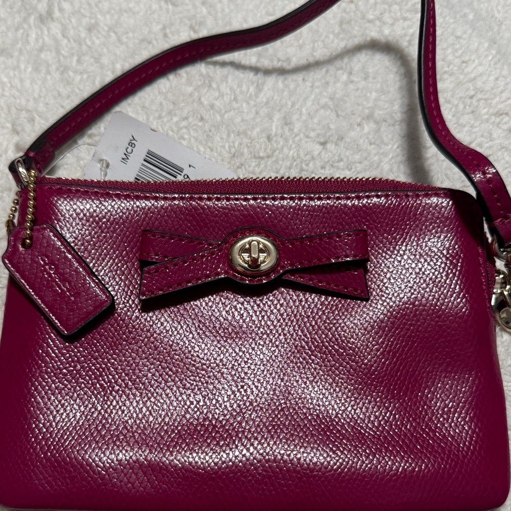 Coach Women's Magenta Wristlet with Bow Detail